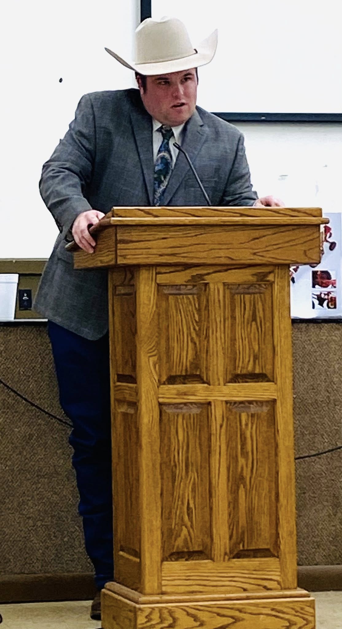 A man standing behind a podium.